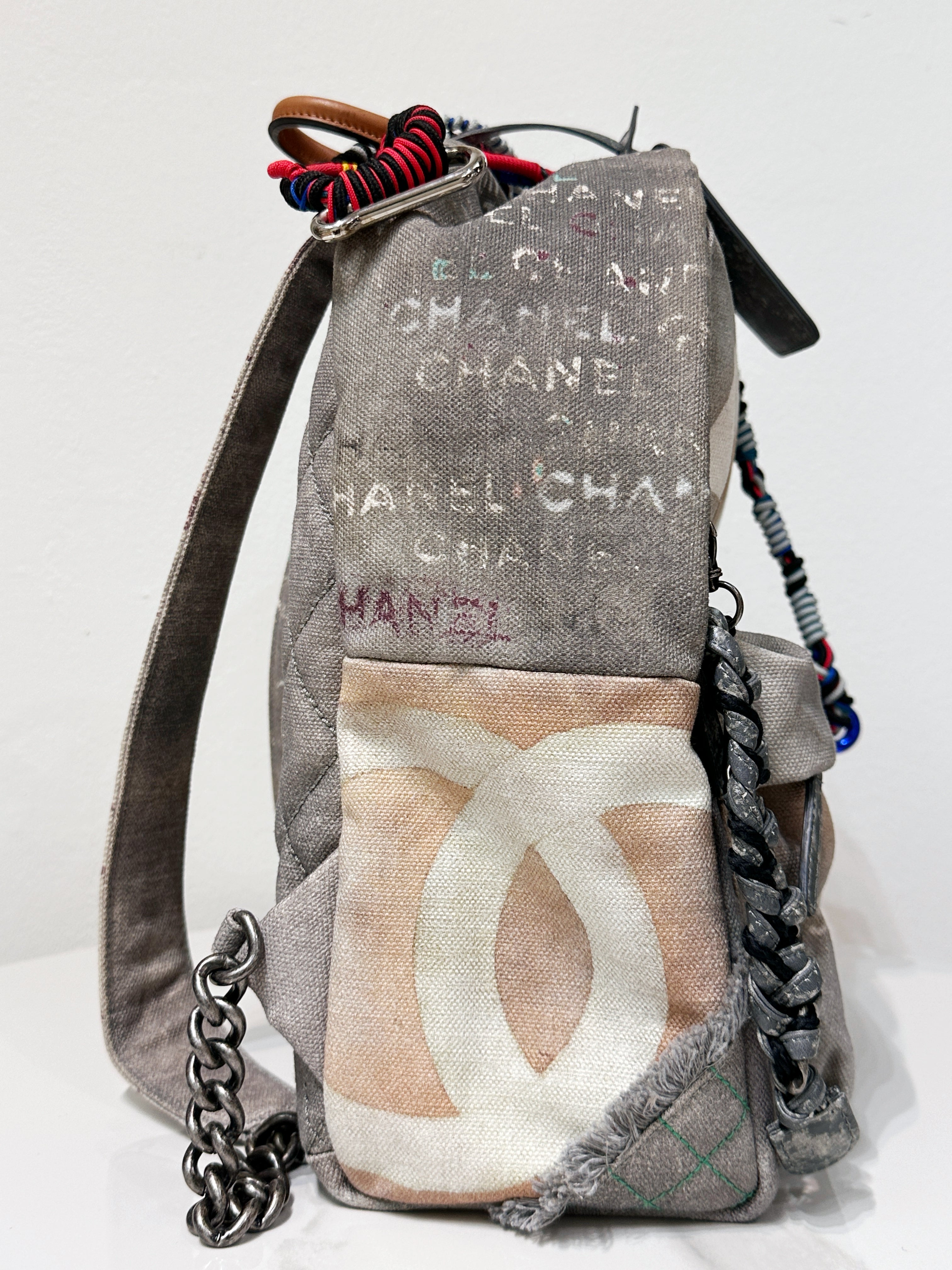 Preloved authentic Chanel Graffiti Printed Canvas Medium Backpack Grey