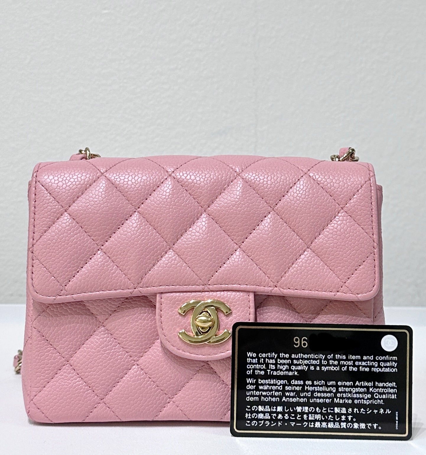 Chanel Mini Square Classic Caviar Flap Pink. Body lightly touched